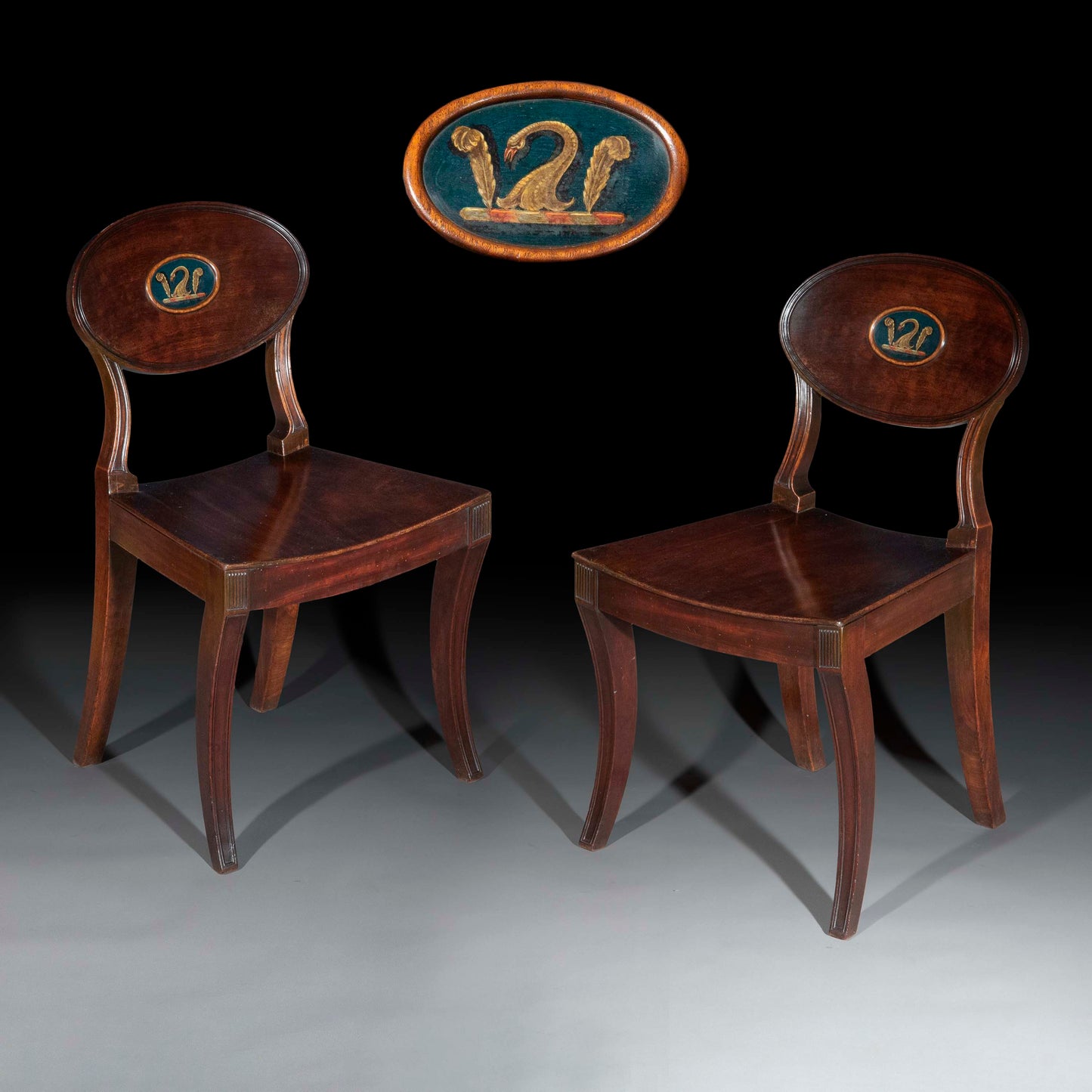 Early 19th Century Pair of Regency Klismos Hall Chairs with Armorial Backs