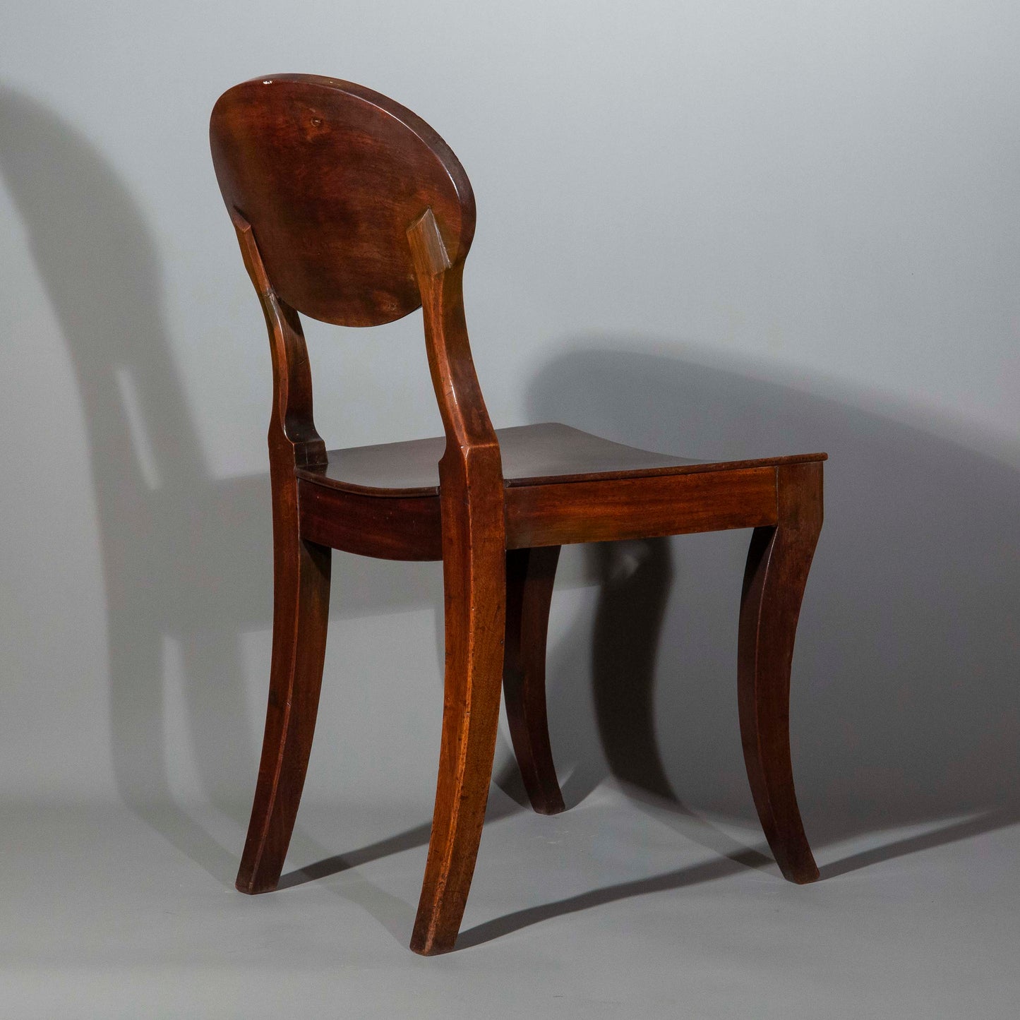 Early 19th Century Pair of Regency Klismos Hall Chairs with Armorial Backs