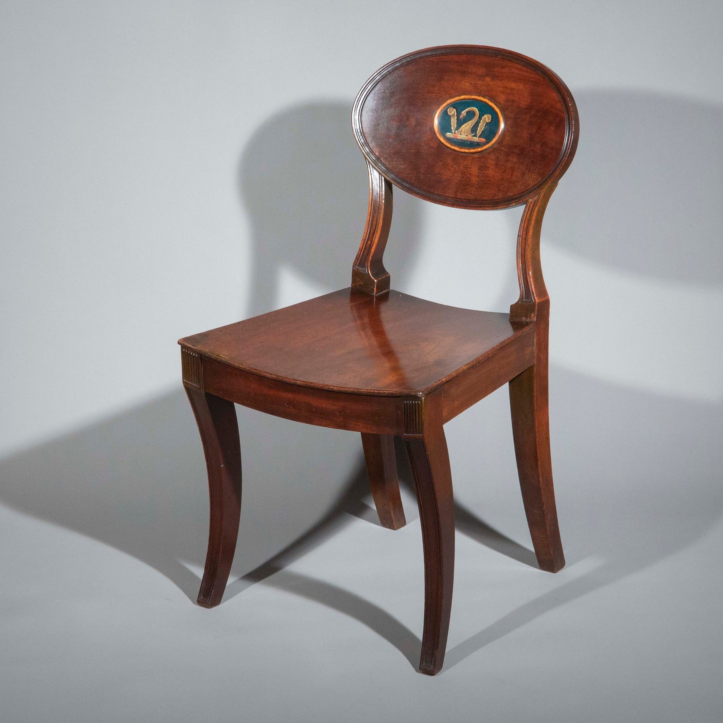 Early 19th Century Pair of Regency Klismos Hall Chairs with Armorial Backs