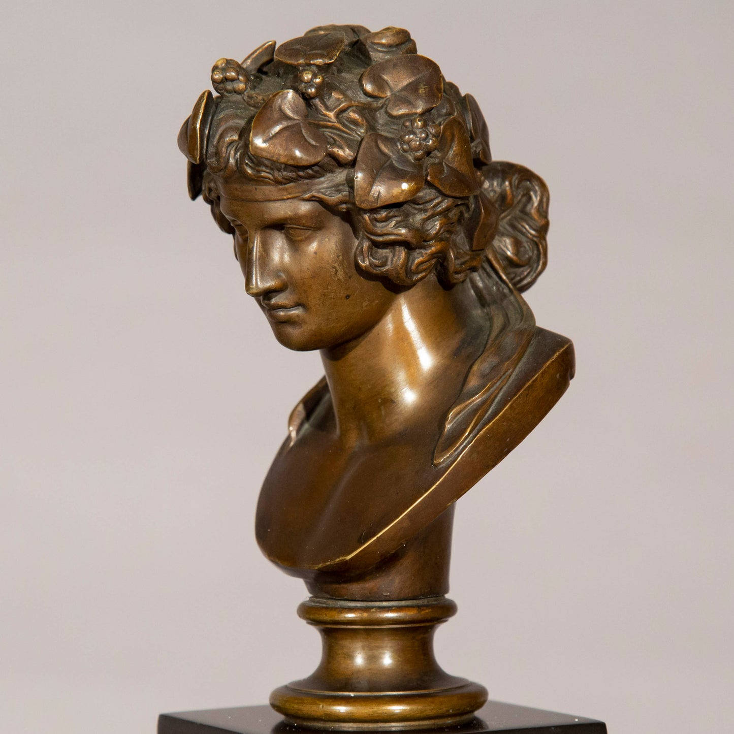 Antinous and Dionysus, a Pair of Bronze Busts on Marble Columns