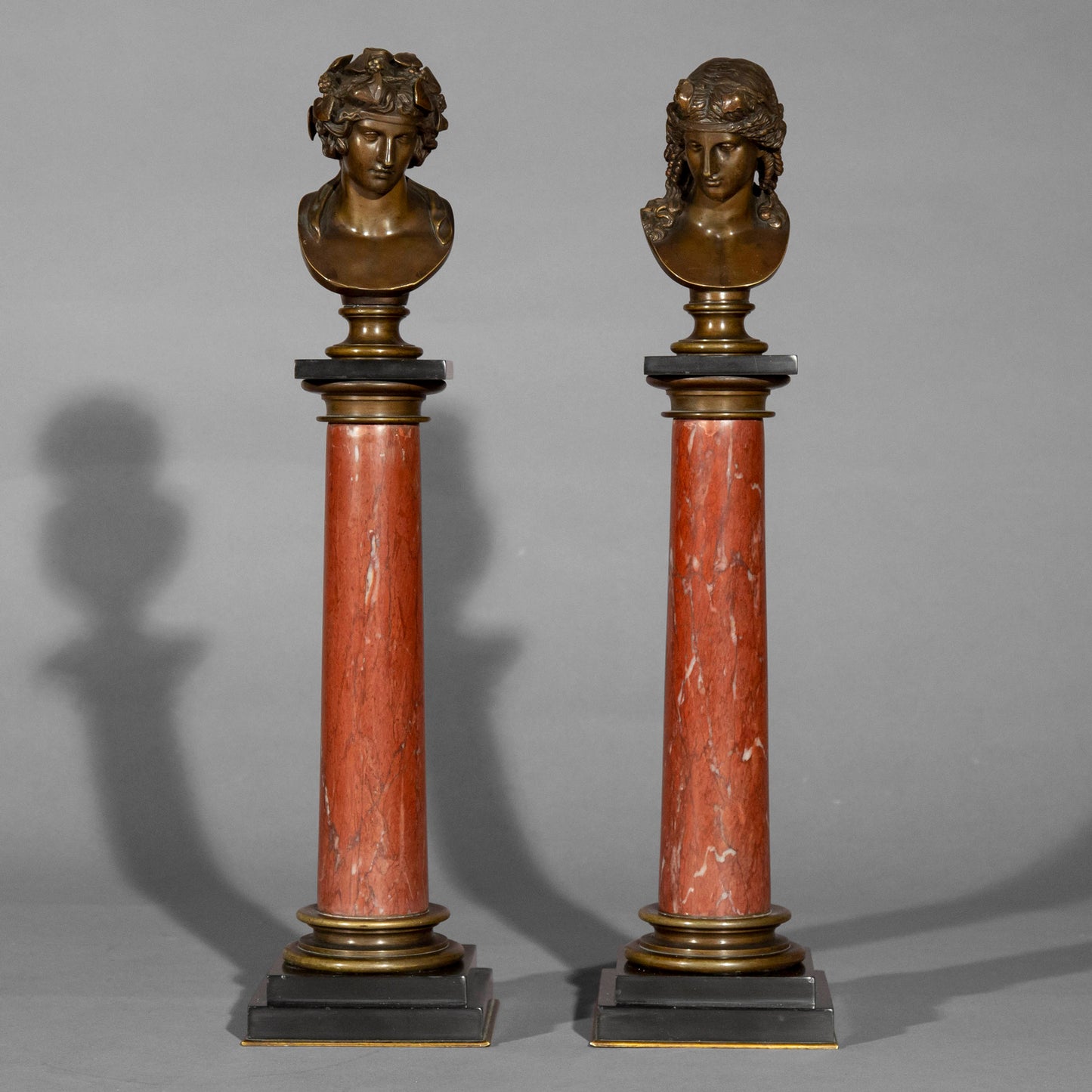 Antinous and Dionysus, a Pair of Bronze Busts on Marble Columns