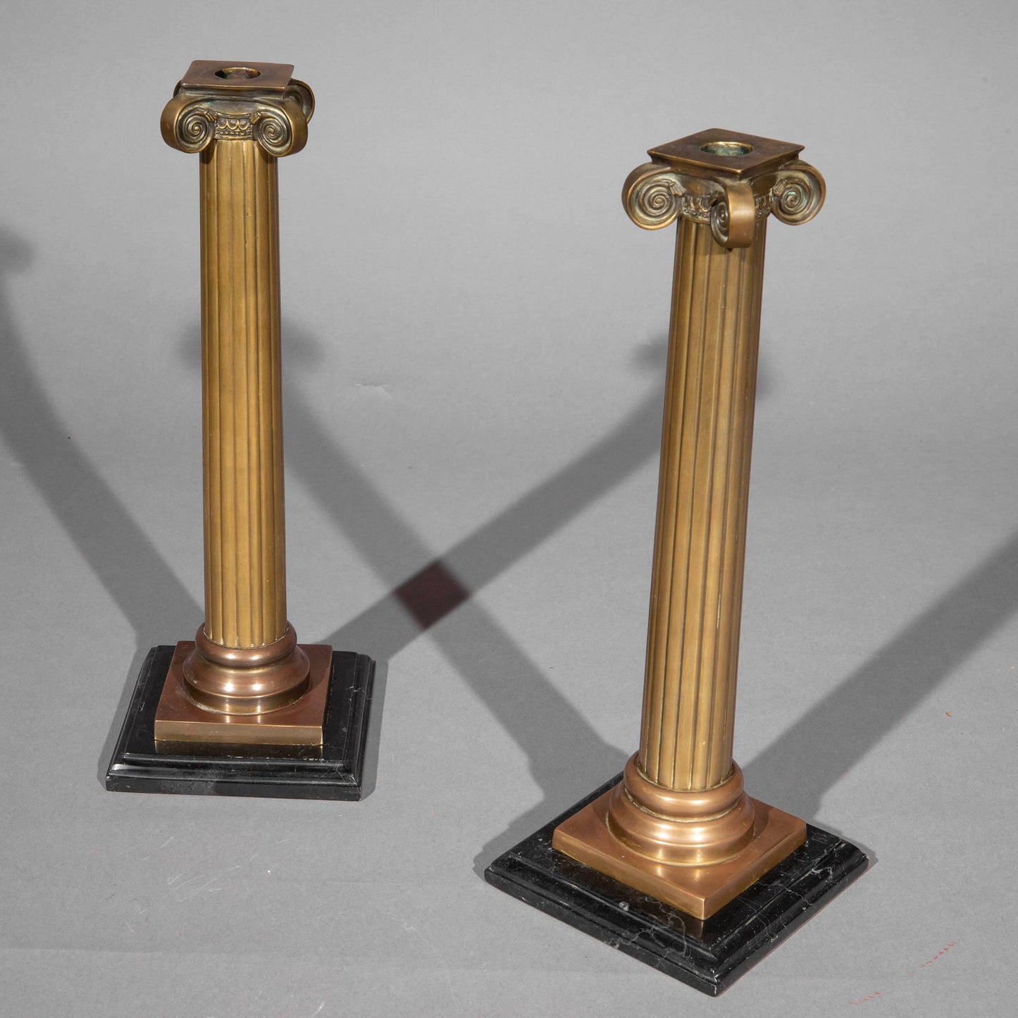 Pair of Ionic Column Bronze Candlesticks