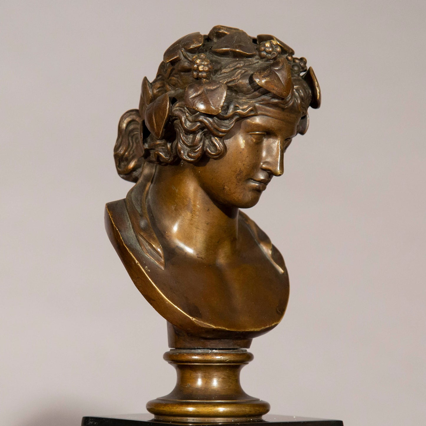 Antinous and Dionysus, a Pair of Bronze Busts on Marble Columns