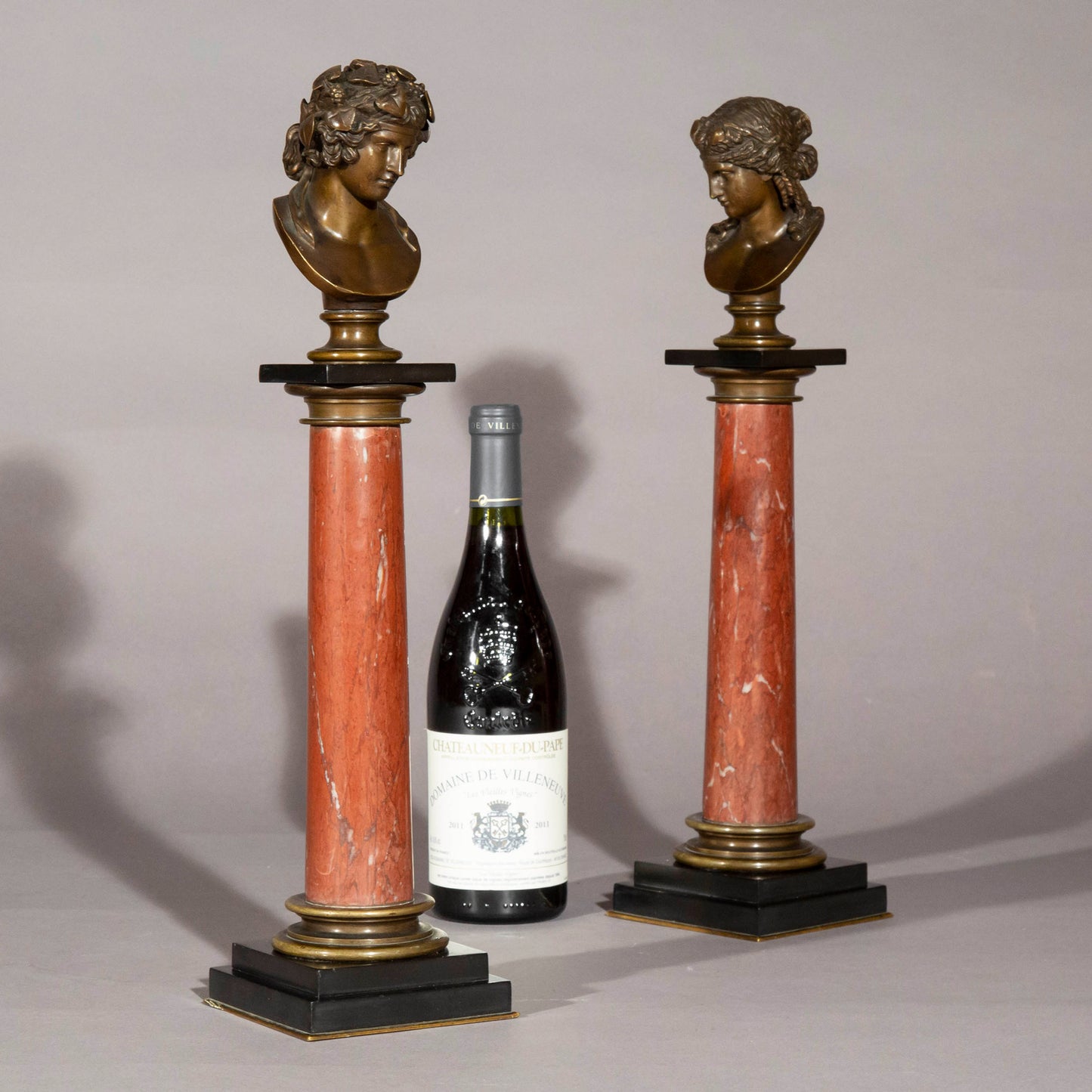 Antinous and Dionysus, a Pair of Bronze Busts on Marble Columns