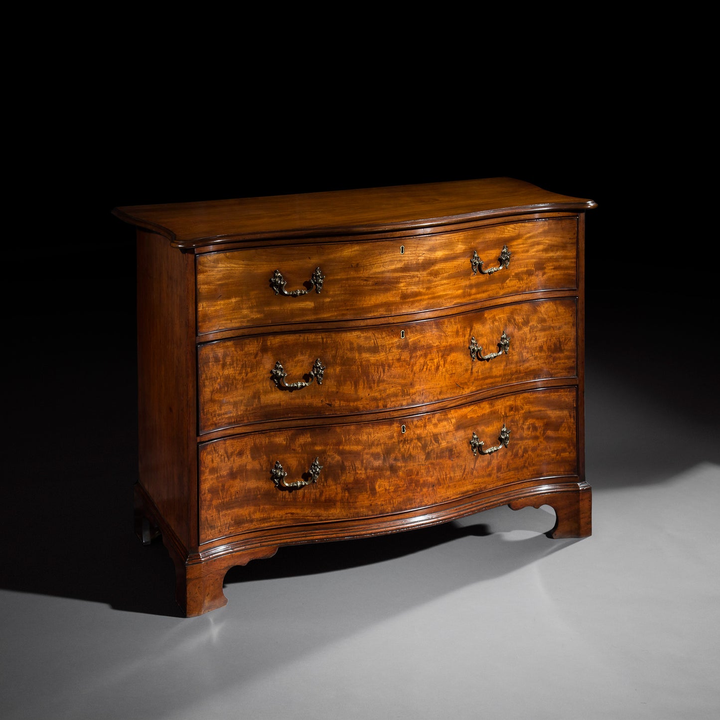 George III Serpentine Chest of Drawers, attributed to Thomas Chippendale