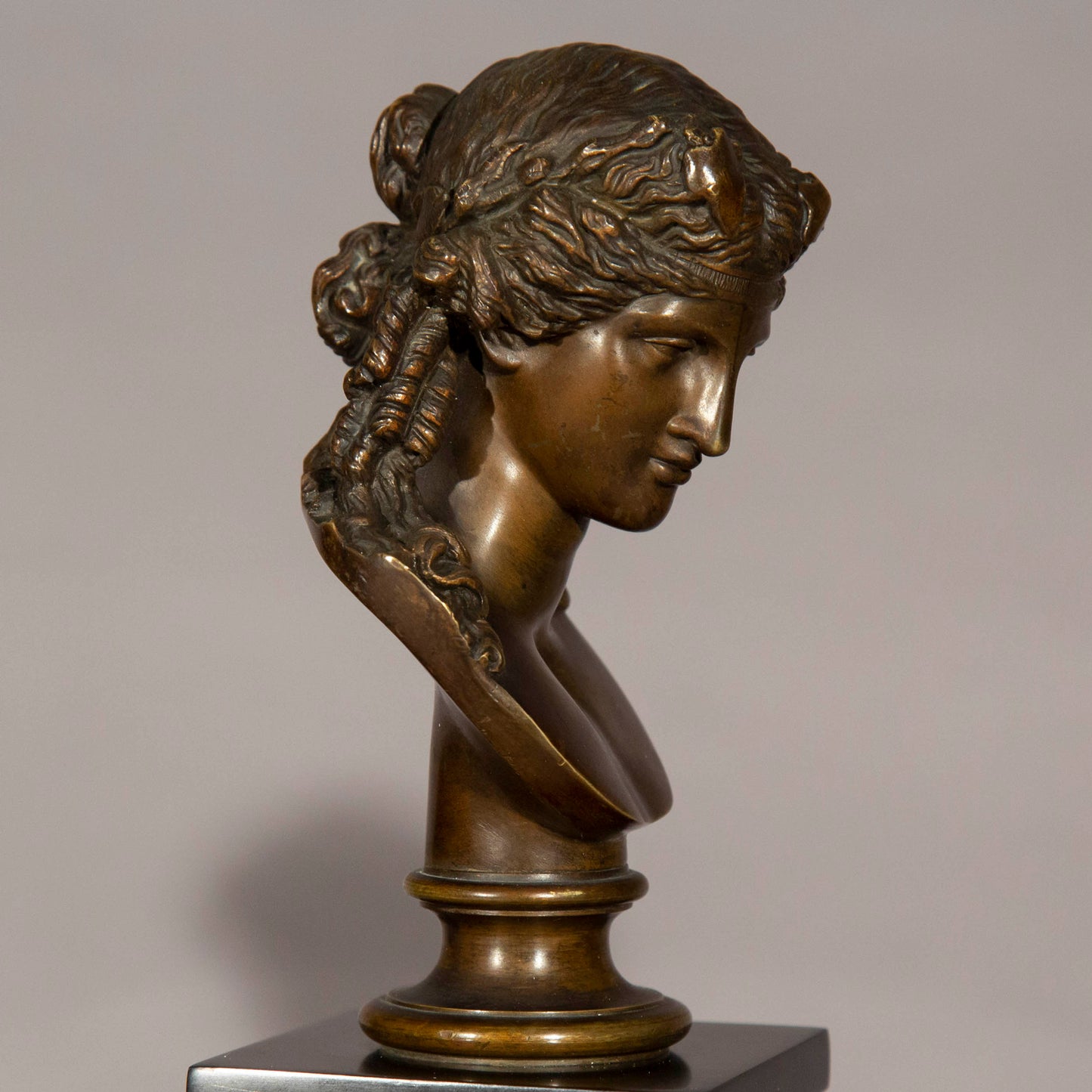 Antinous and Dionysus, a Pair of Bronze Busts on Marble Columns
