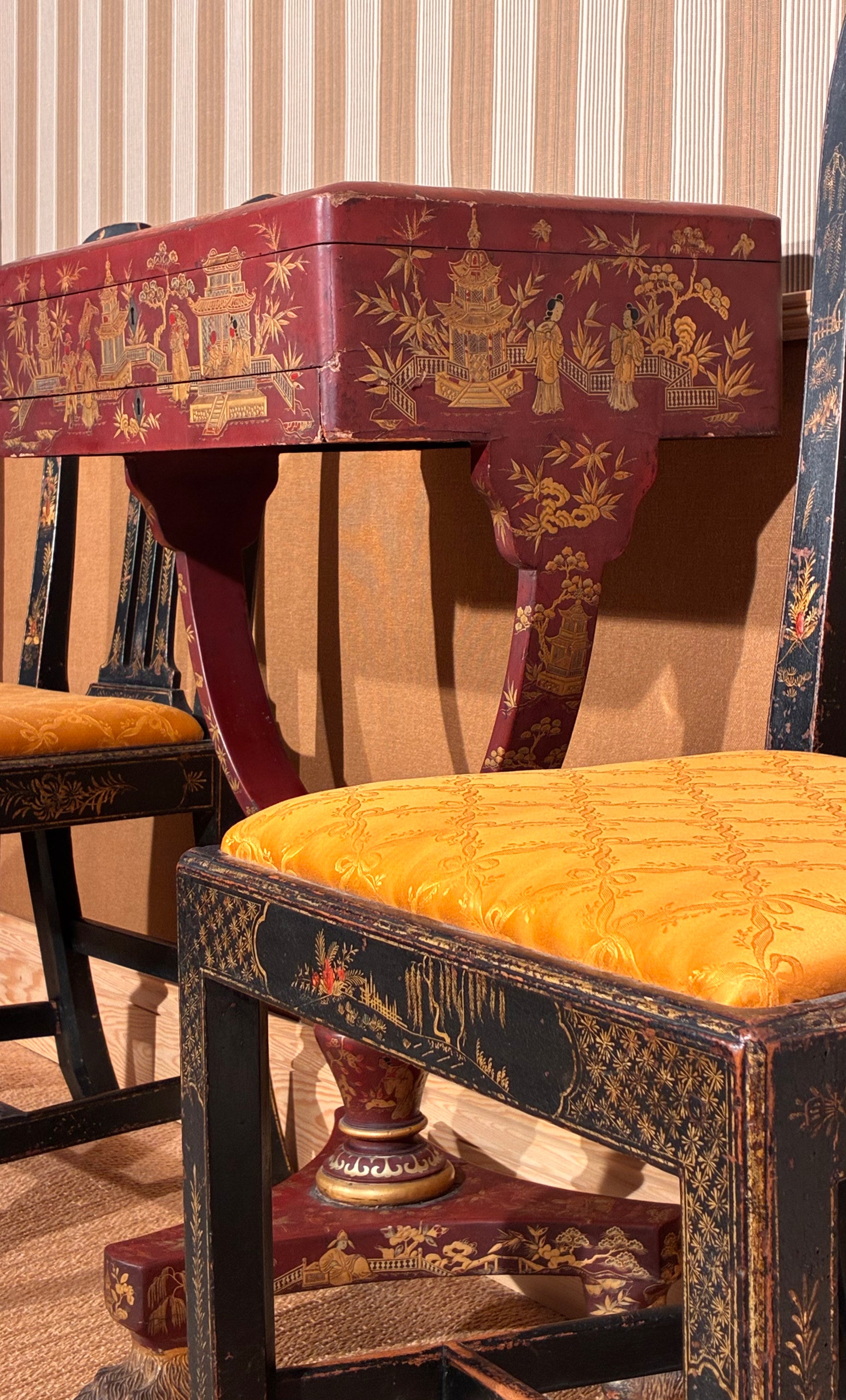 18th century black and gilt chinoiserie chairs, 19th century red lacquer chinoiserie table 