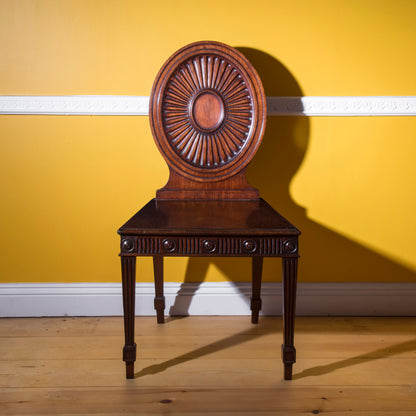 Pair of George III Hall Chairs, attributed to Mayhew and Ince