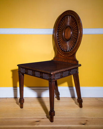 Pair of George III Hall Chairs, attributed to Mayhew and Ince